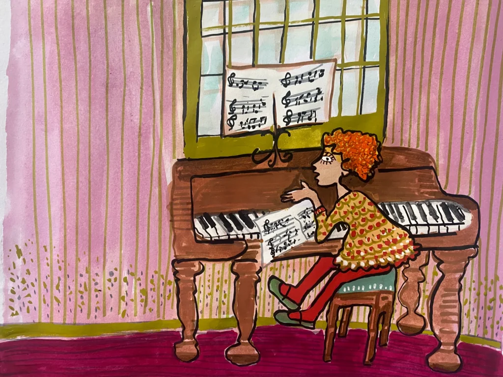 Uma menina sentada ao piano.