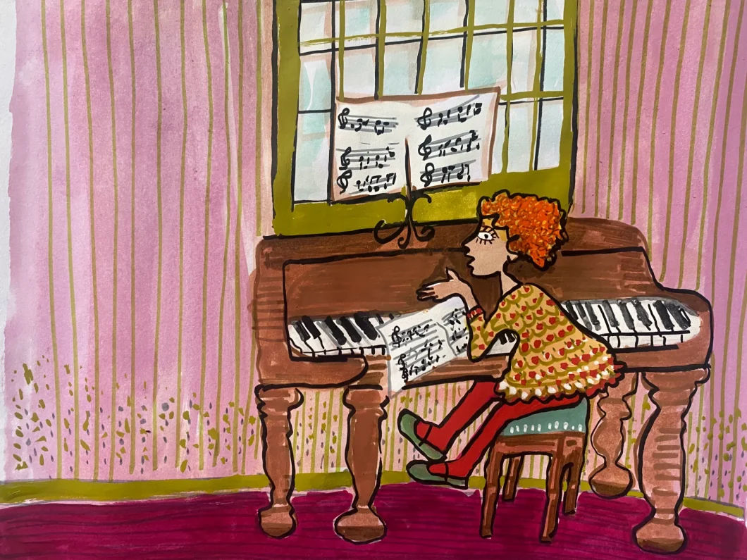 Uma menina sentada ao piano.